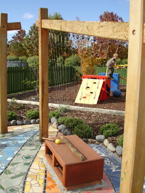 A child playing in the outdoor activity space